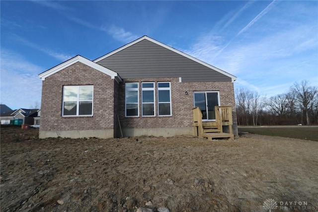 back of property with brick siding