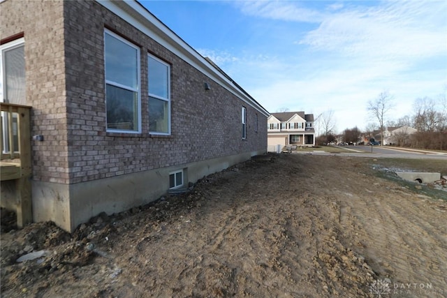 view of home's exterior featuring brick siding