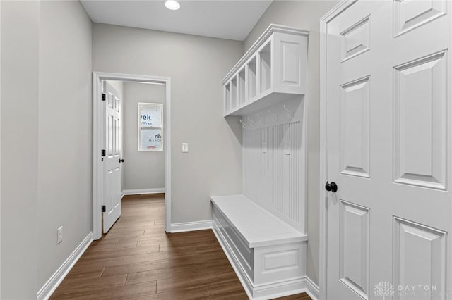 mudroom with baseboards and dark wood finished floors