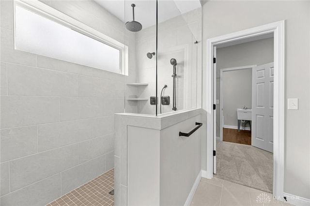 bathroom featuring baseboards and walk in shower