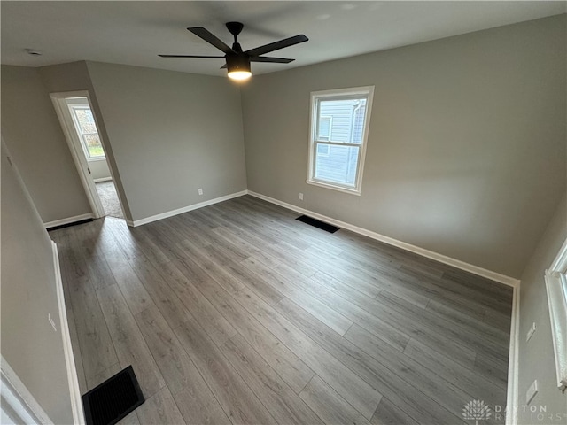 empty room featuring ceiling fan and wood-type flooring