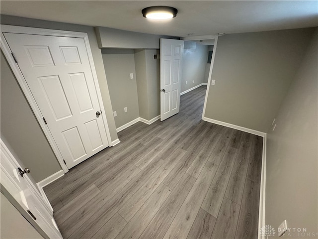 basement with wood-type flooring