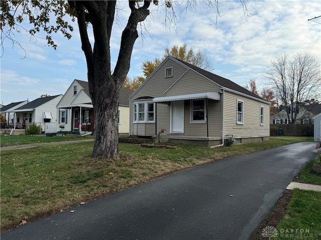 bungalow with a front lawn