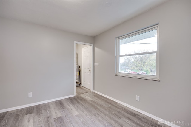 spare room with light hardwood / wood-style floors