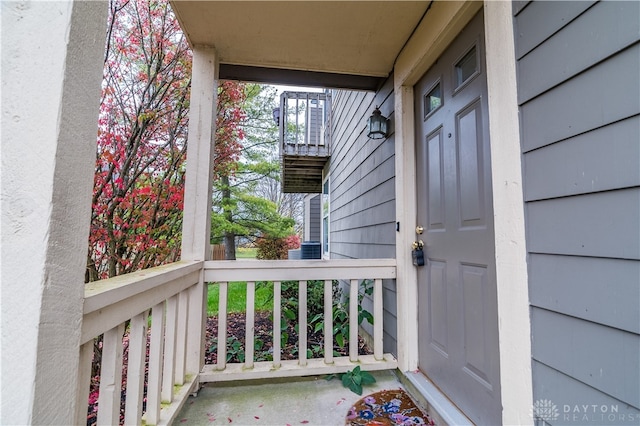 view of exterior entry featuring a porch