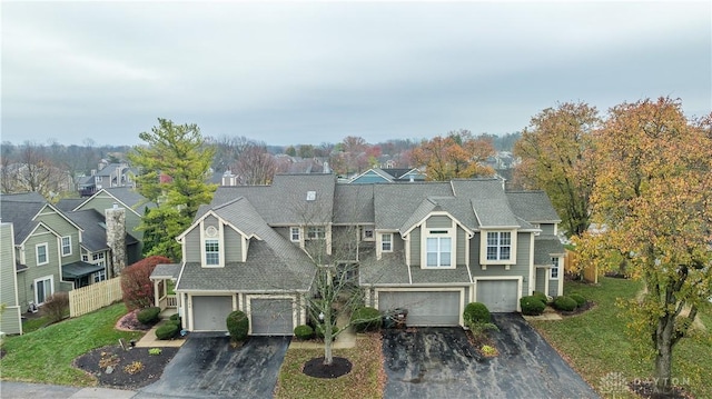 view of front of house with driveway, a garage, and a front yard