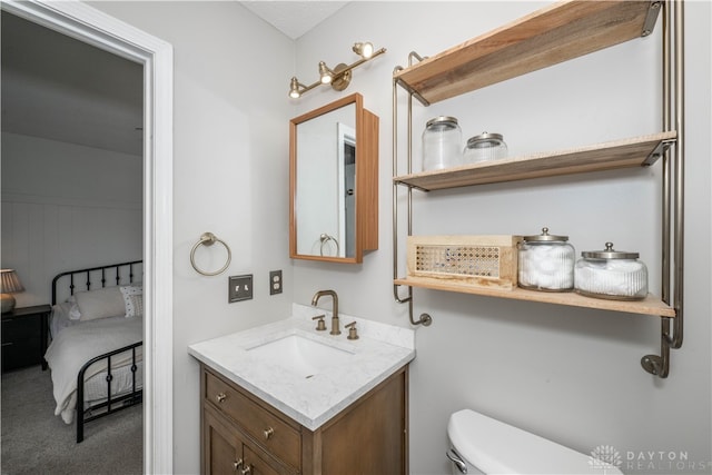 bathroom with vanity and toilet