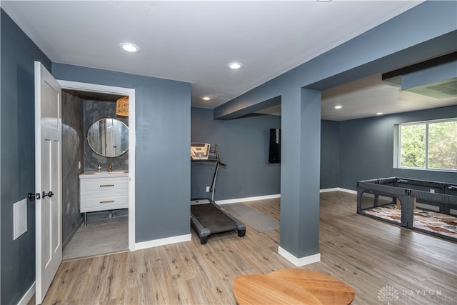 workout area featuring light hardwood / wood-style flooring