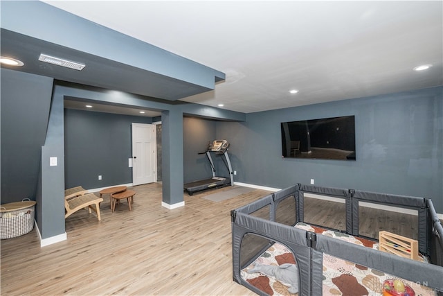 recreation room with light hardwood / wood-style floors