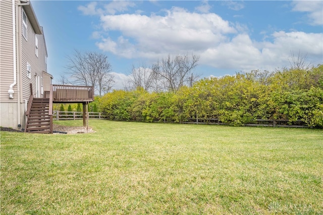 view of yard featuring a wooden deck