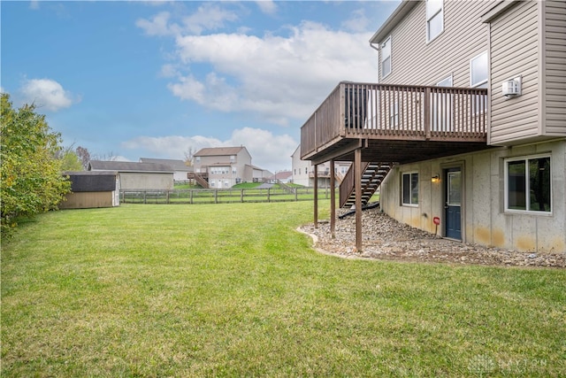 view of yard with a shed and a wooden deck