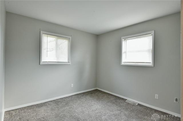 spare room with carpet floors