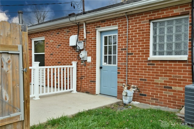 doorway to property with central air condition unit