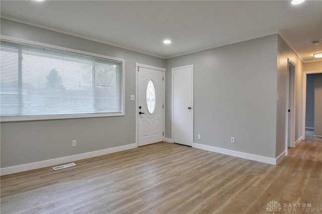 foyer entrance with light wood-type flooring