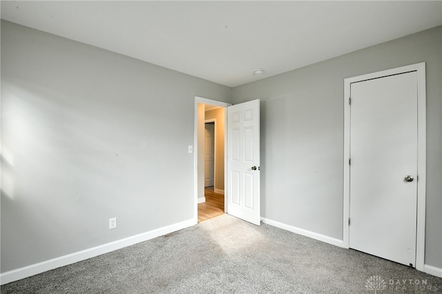 unfurnished bedroom with carpet