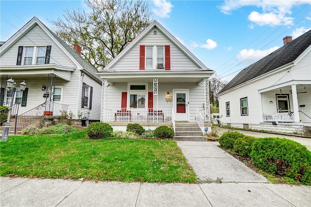 bungalow with a front yard