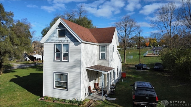 view of home's exterior with a lawn