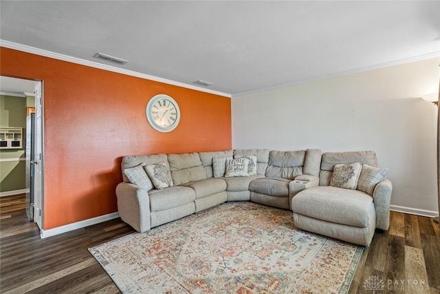 living room featuring dark hardwood / wood-style flooring and ornamental molding