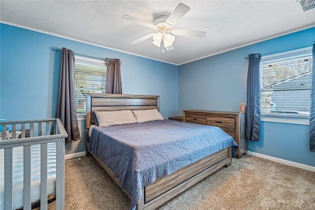 bedroom with carpet flooring, ceiling fan, and multiple windows