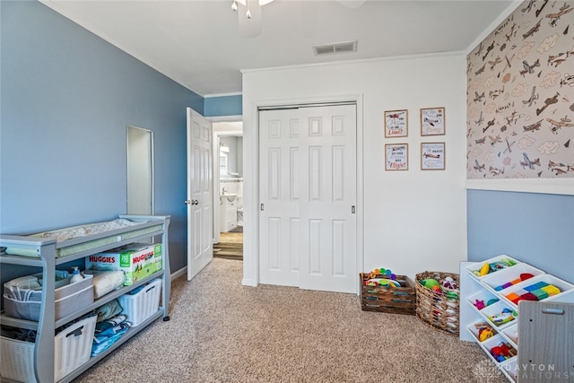 game room with crown molding and carpet