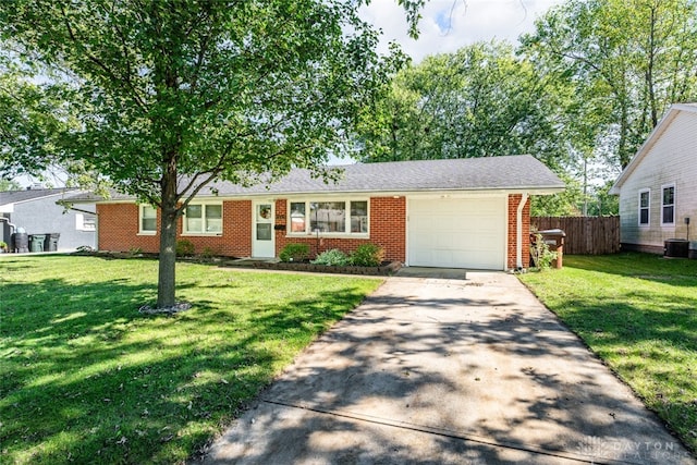 ranch-style house with central AC, a front lawn, and a garage