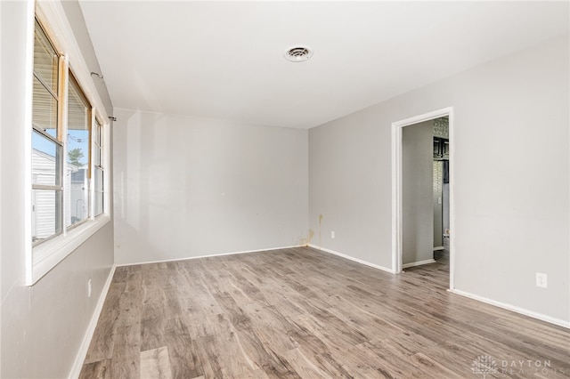 spare room featuring hardwood / wood-style floors