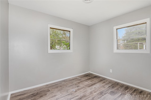 spare room featuring hardwood / wood-style floors