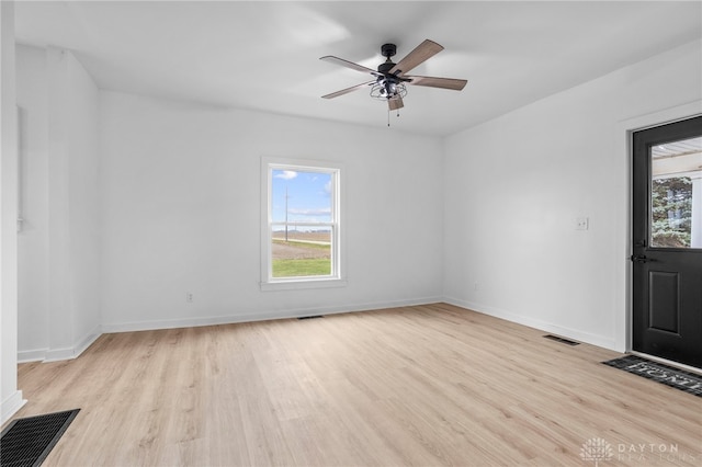 unfurnished room featuring ceiling fan and light wood-type flooring