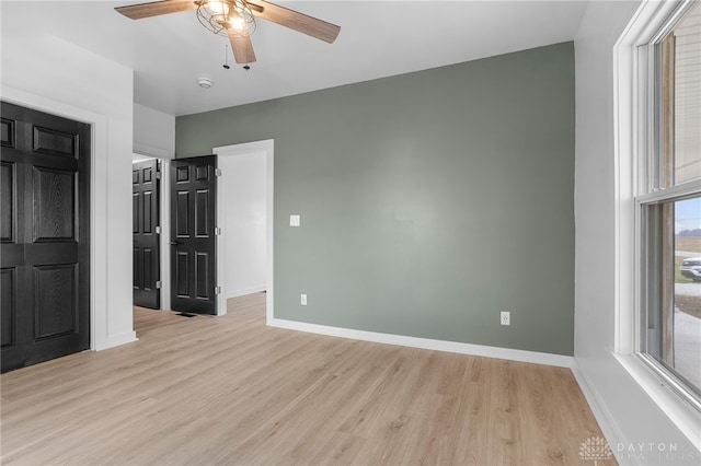 unfurnished bedroom featuring light hardwood / wood-style flooring and ceiling fan