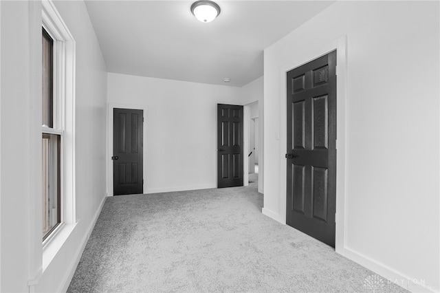 unfurnished room with carpet floors