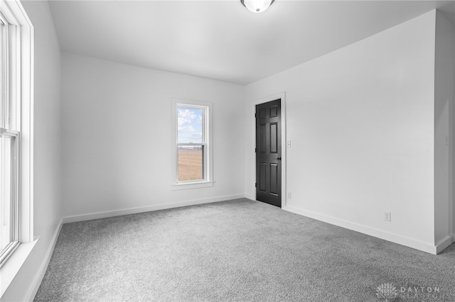 unfurnished room featuring carpet floors