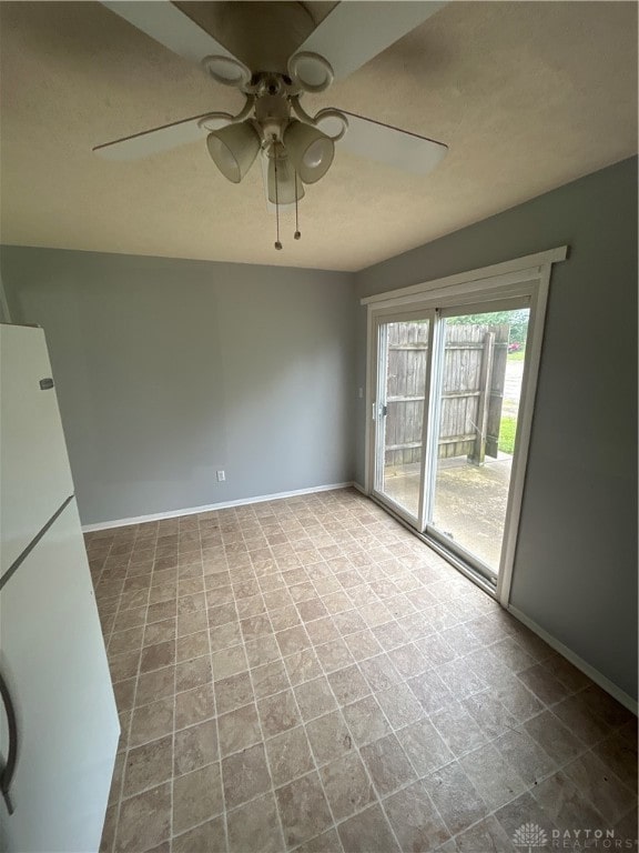 empty room featuring ceiling fan