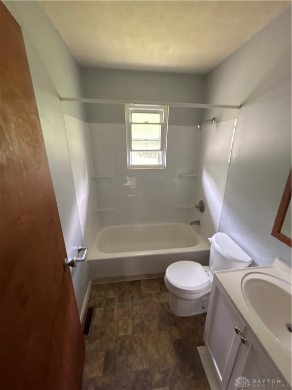 full bathroom with toilet, vanity, and bathtub / shower combination