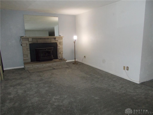 11031 N Montgmy Co L Rd, Union Twp, OH 45309 - unfurnished living room with carpet, a stone fireplace, and baseboards