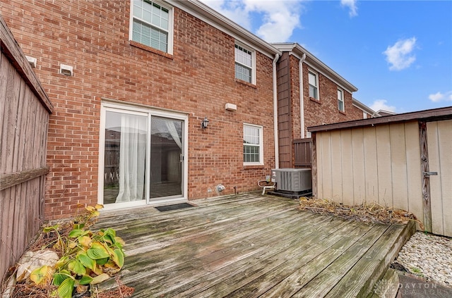 wooden deck with central air condition unit