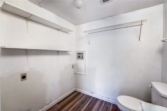 clothes washing area featuring electric dryer hookup, dark wood-type flooring, and hookup for a washing machine