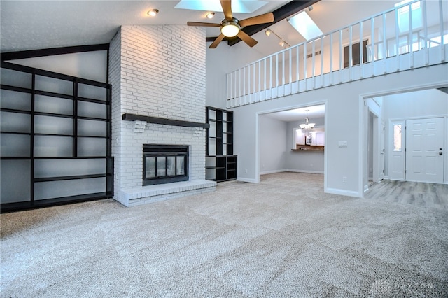 unfurnished living room featuring carpet, a fireplace, ceiling fan, high vaulted ceiling, and baseboards