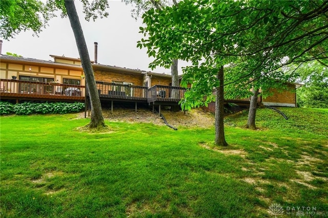 view of yard with a wooden deck