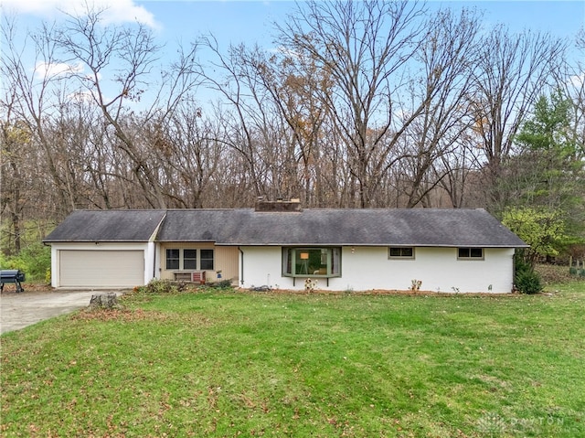 ranch-style house with a garage and a front yard