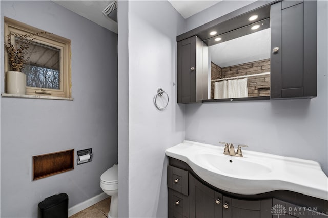 bathroom featuring tile patterned flooring, vanity, toilet, and a shower with curtain