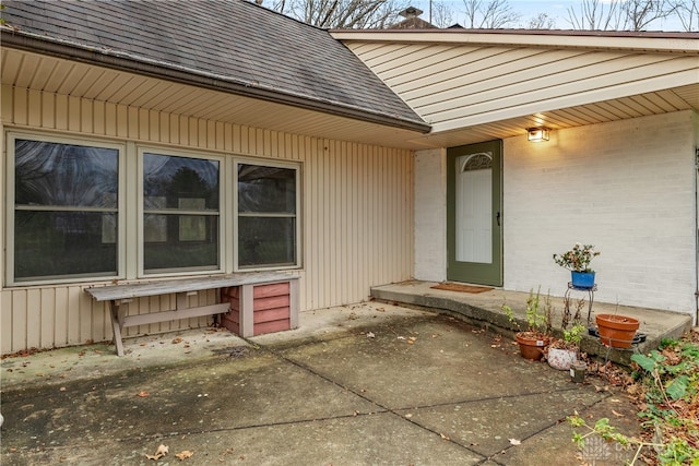 entrance to property with a patio