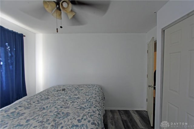 bedroom featuring dark wood-type flooring and ceiling fan