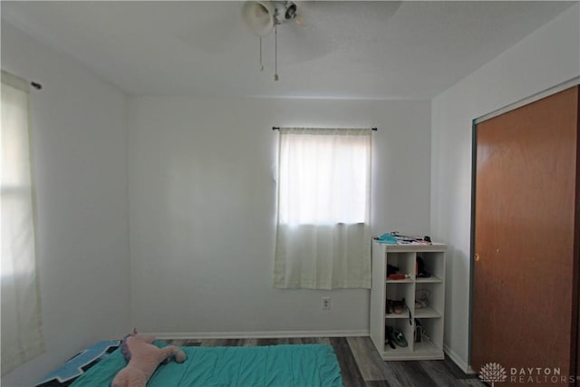 unfurnished bedroom with dark wood-type flooring