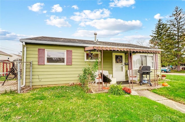 bungalow-style home featuring a patio area and a front yard