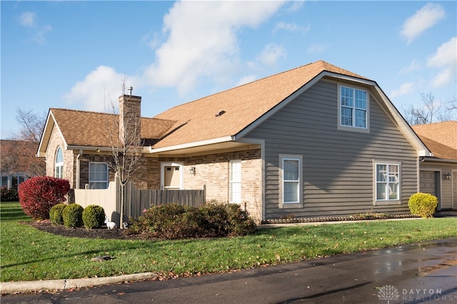 view of side of home featuring a yard