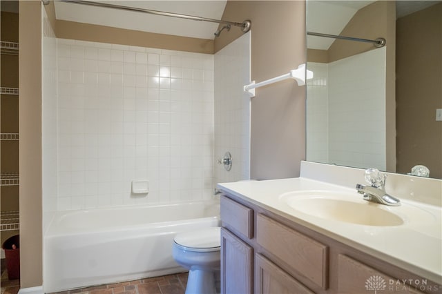 full bathroom featuring vanity, toilet, and tiled shower / bath combo