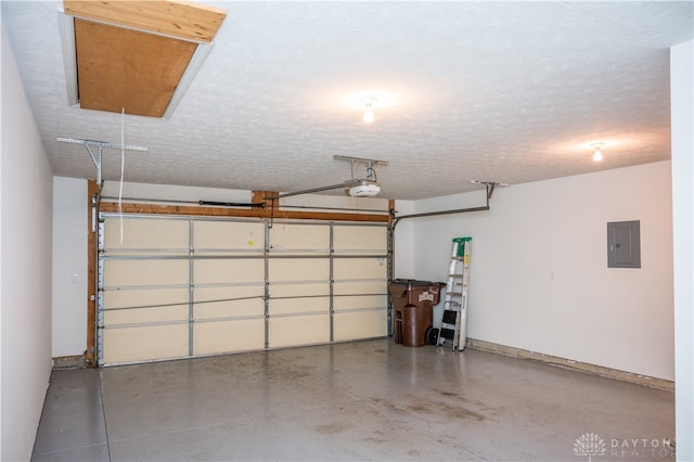 garage with electric panel and a garage door opener