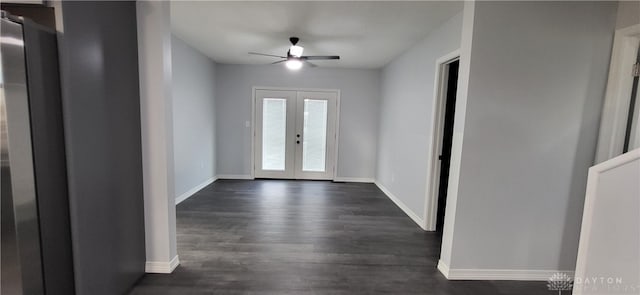 entrance foyer featuring ceiling fan, french doors, and dark wood-type flooring