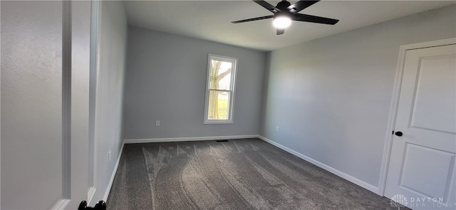 carpeted empty room featuring ceiling fan