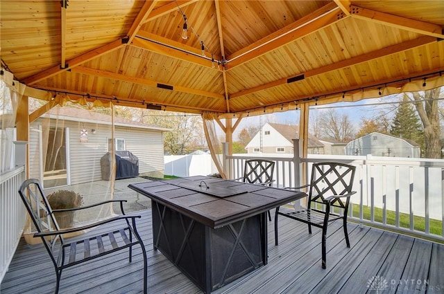 wooden deck featuring a gazebo and grilling area